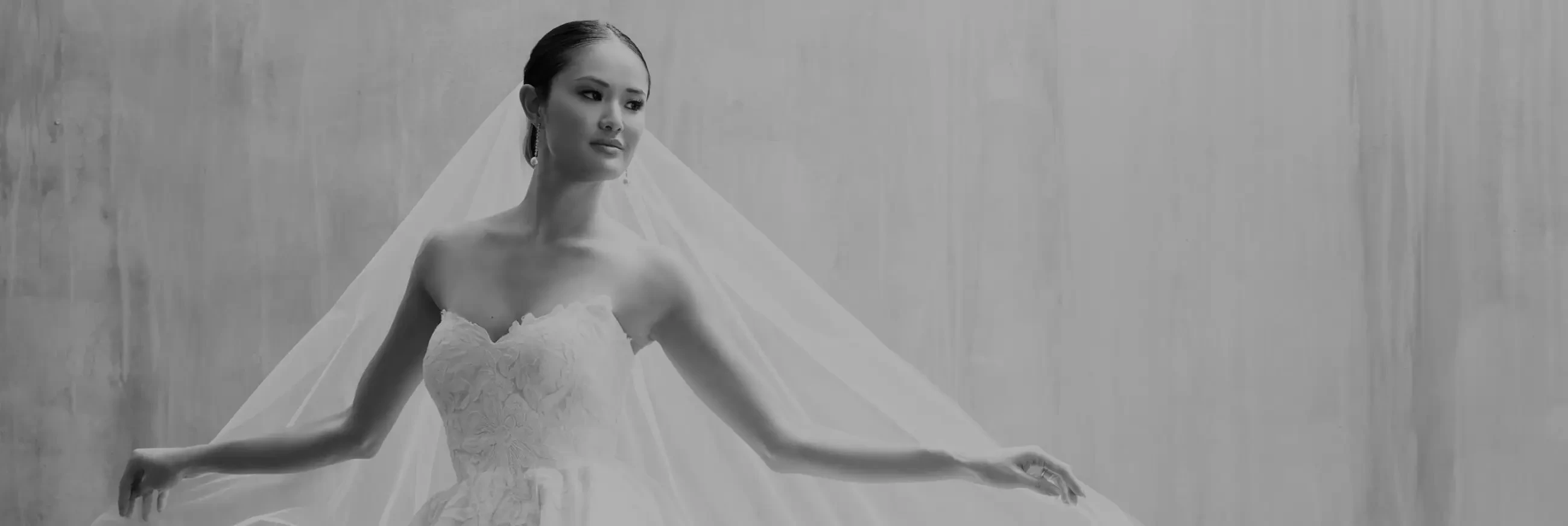 Model wearing a white bridal gown