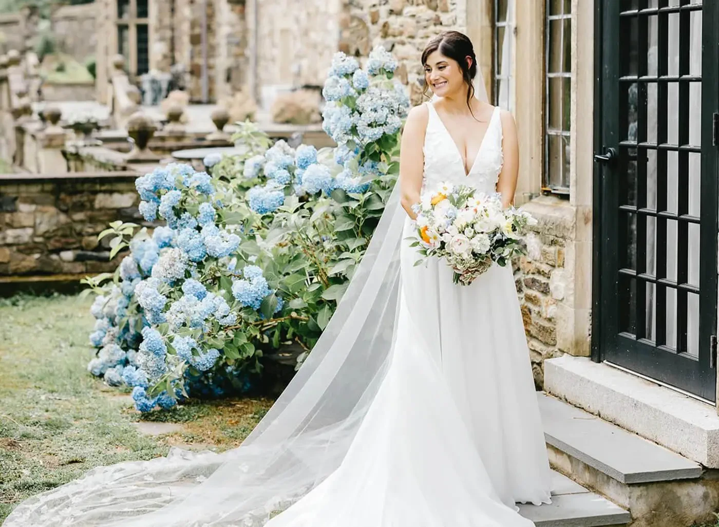 Model wearing a bridal dress with flowers